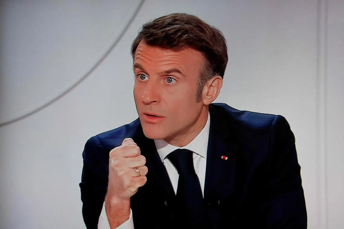 French President Emmanuel Macron takes part in a live interview at the Elysee Palace in Paris.