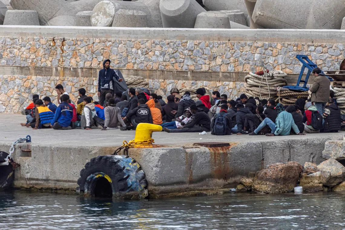 Migrants gather at the port of the village of Sfakia, following a rescue operation at open sea, on the island of Crete, Greece, on May 28.
