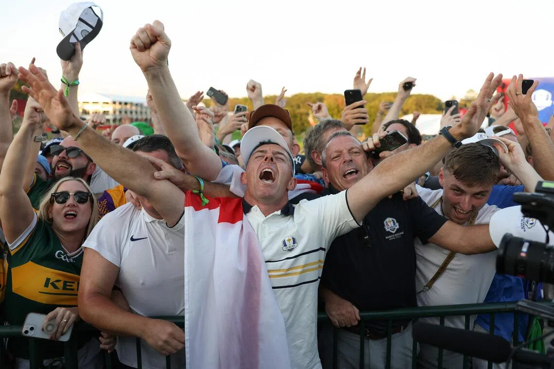 Rory McIlroy of Team Europe celebrating with fans during the Sunday singles matches of the 2025 Ryder Cup on Sept 28.