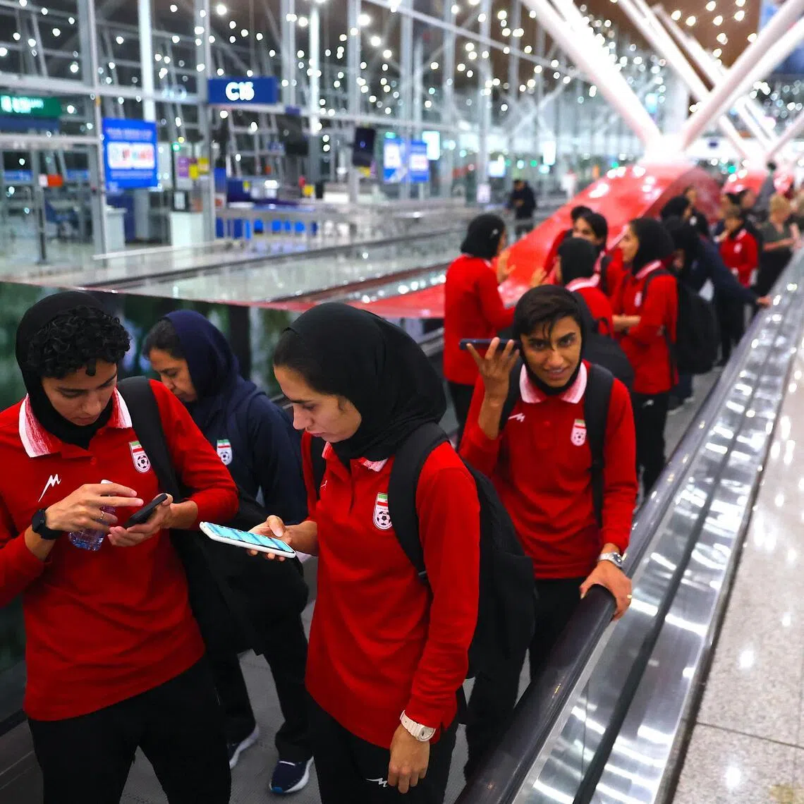 Members of the Iranian women's national football team arriving at the Kuala Lumpur International Airport in Sepang on March 11.