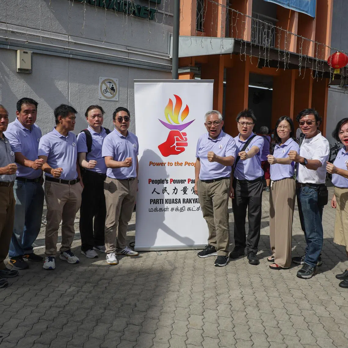 People's Power Party chief Goh Meng Seng (sixth from right) with party members during a walkabout in Tampines on Feb 23.