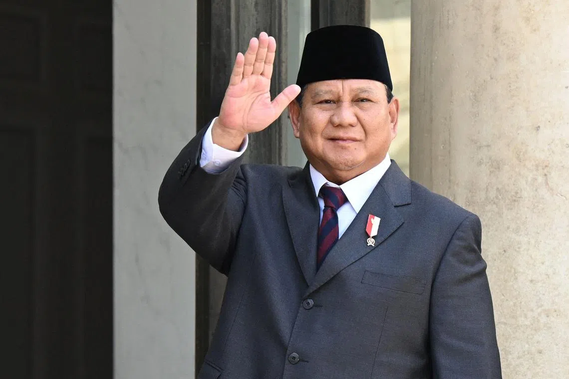 Indonesia’s Defence Minister Prabowo Subianto gestures at the entrance of the Elysee Palace in Paris on July 21, 2023, amid a visit to France to discuss "strategic and economic cooperation". Indonesian Ministers met earlier on July 21, 2023, with the French Minister of Foreign Affairs and French Army Minister. (Photo by Bertrand GUAY / AFP)