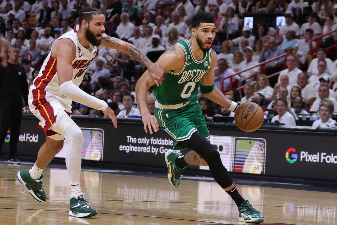 Jayson Tatum of the Boston Celtics driving ahead of Caleb Martin of the Miami Heat during game four of the Eastern Conference Finals at Kaseya Centre. Tatum led all scorers with 34 points, 11 rebounds and assists.