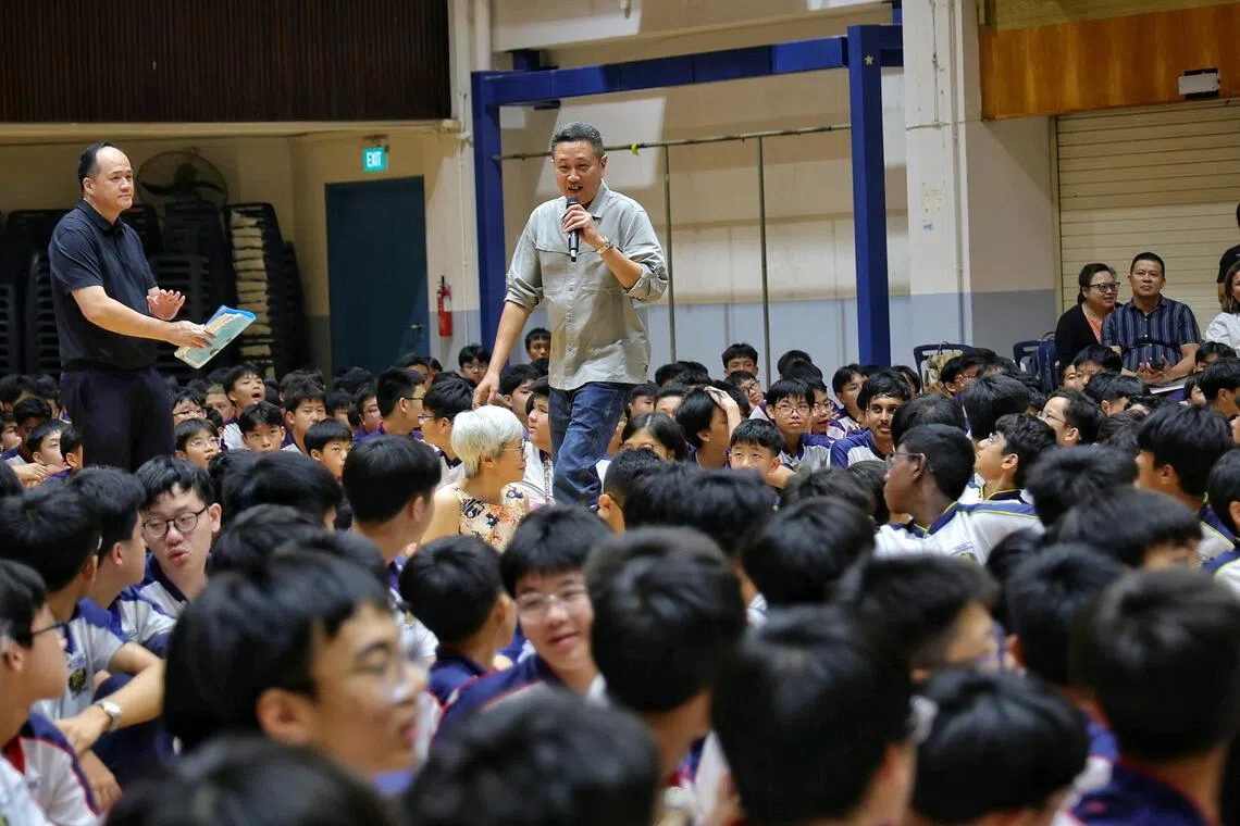 ST senior crime correspondent Zaihan Mohamed Yusof telling students at St Gabriel’s Secondary School about the time he was mistaken for a spy, during a What’s The News? assembly programme on Aug 28.