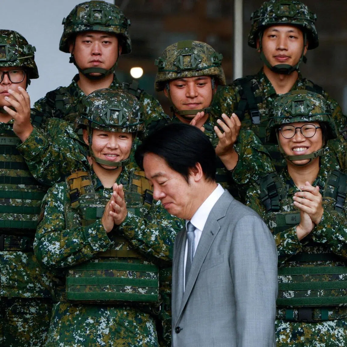 Soldiers applaud as Taiwan President Lai Ching-te arrives for a group photo at the Guandu Area Command in New Taipei City, Taiwan on June 16, 2026.     