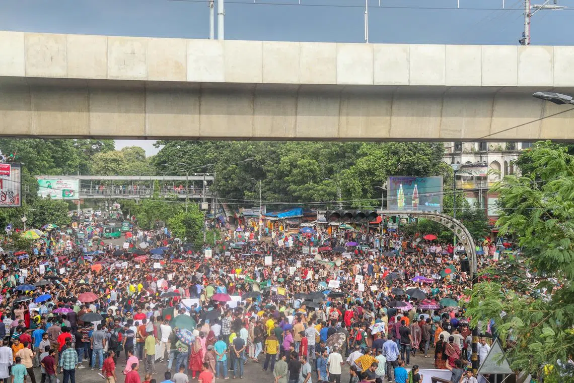 Members of the Bangladesh Hindu community participate in a protest and block the Shahbagh intersection in Dhaka, Bangladesh, on Aug 10.