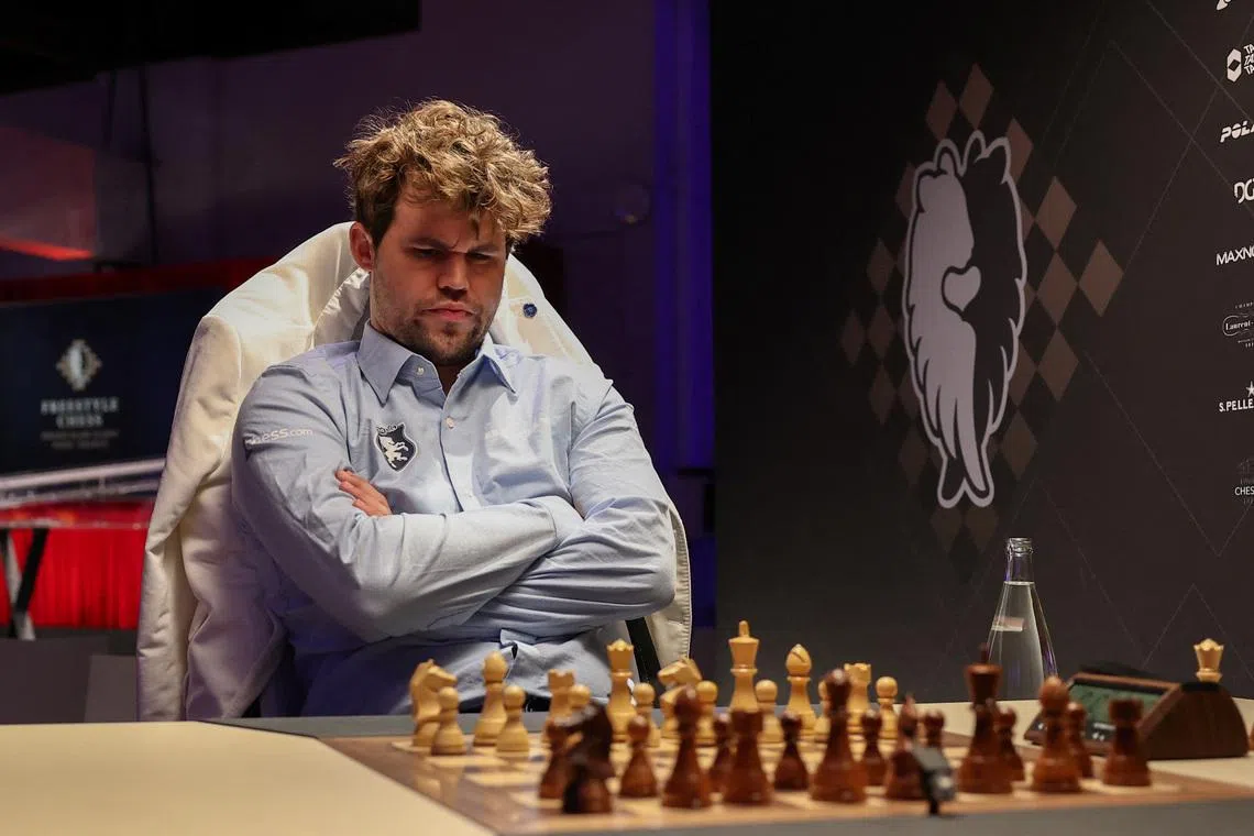 Chess grandmaster Magnus Carlsen reacts ahead of the Freestyle Chess Grand Slam Tour in Paris, France, April 7, 2025. REUTERS/Gonzalo Fuentes