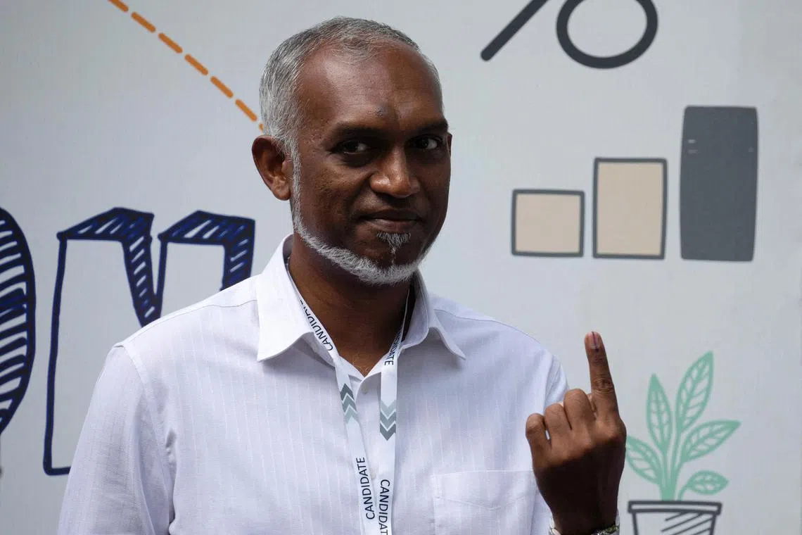 FILE PHOTO: Mohamed Muizzu, Maldives presidential candidate of the opposition party, People's National Congress gestures after casting his vote at a polling station during the Maldives presidential election day in Male, Maldives September 9, 2023. REUTERS/Dhahau Naseem/File Photo