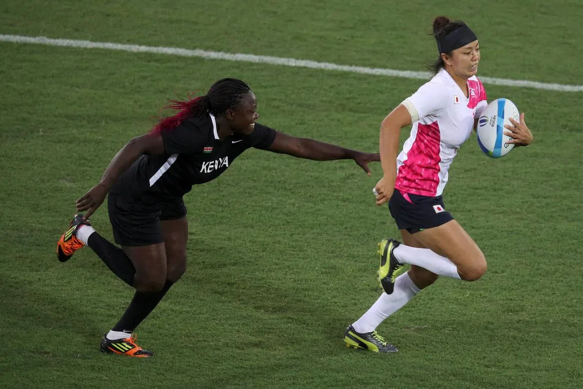 FILE PHOTO: 2016 Rio Olympics - Rugby -  Deodoro Stadium - Rio de Janeiro, Brazil - 07/08/2016.  Ano Kuwai (JPN) of Japan evades a tackle by Janet Awino (KEN) of Kenya to score a try. REUTERS/Phil Noble (BRAZIL)/File Photo