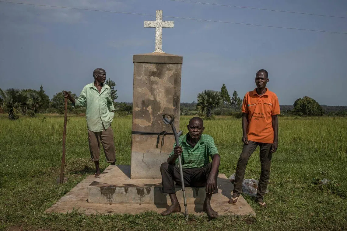 Residents gather next to the Lukodi Massacre Memorial Monument on Sept 4, 2025.