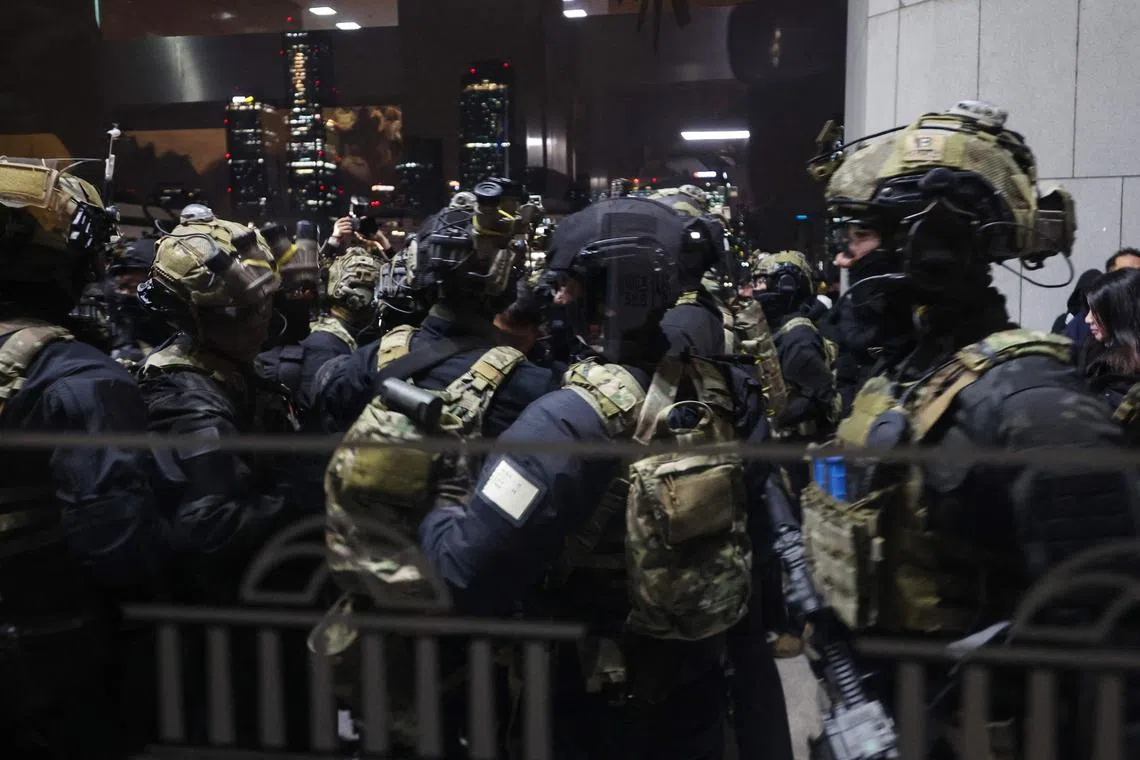 Soldiers trying to enter the National Assembly in Seoul on Dec 4 after South Korea President Yoon Suk Yeol declared martial law.