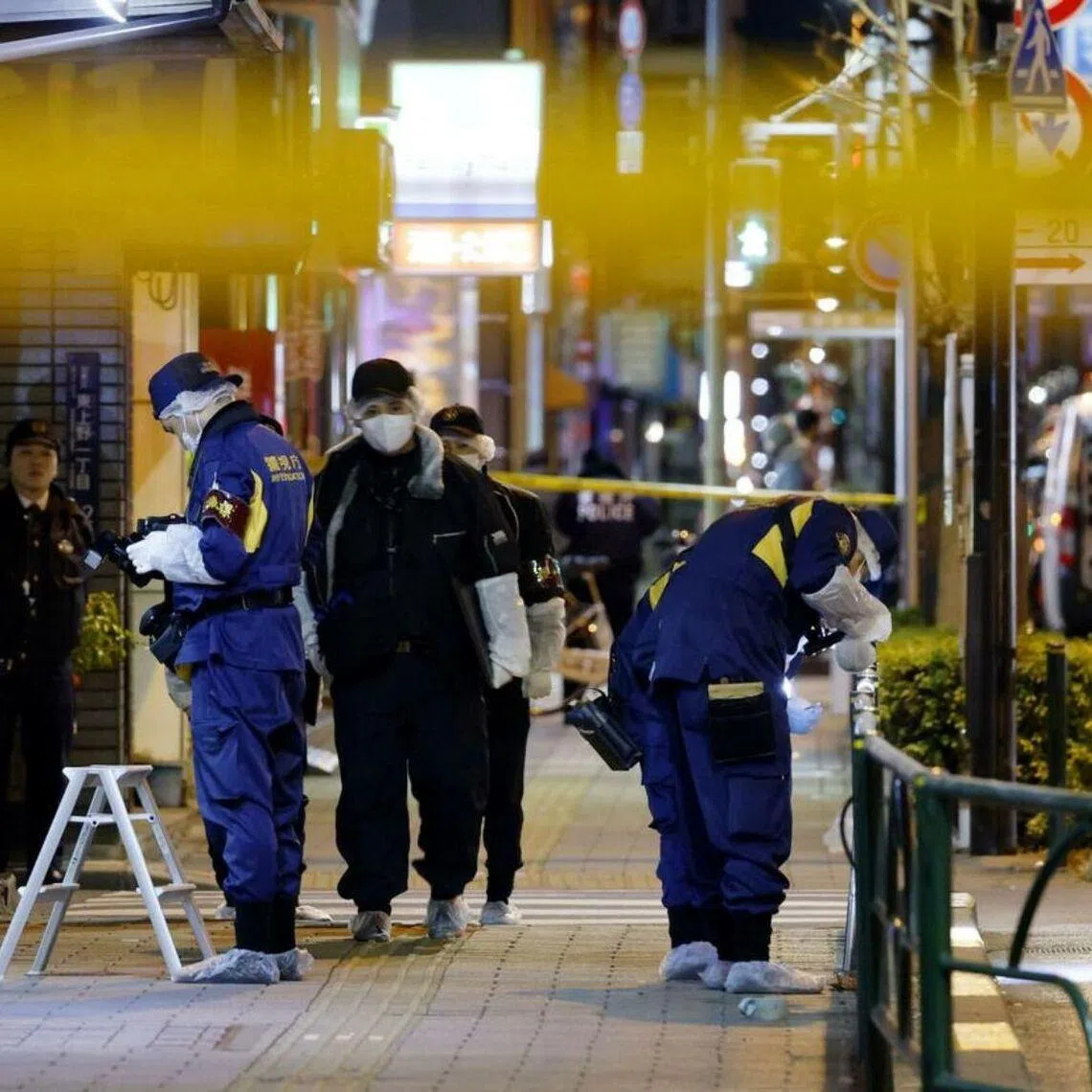 Investigators work in the area of a suspected robbery in Tokyo's Taito ward in the early hours of Jan 30.