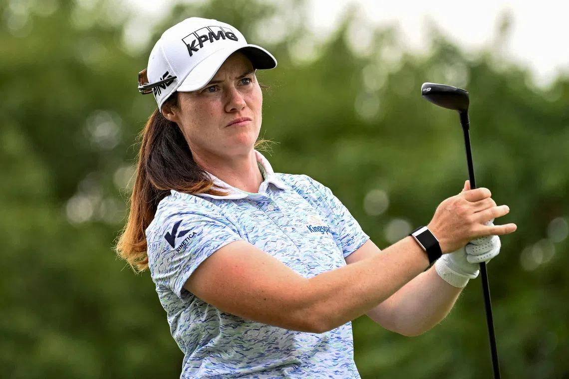 FILE PHOTO: Aug 23, 2025; Mississauga, Ontario, CAN;  Leona Maguire watches her tee shot at the third hole during third round play at the CPKC Women's Open golf tournament. Mandatory Credit: Dan Hamilton-Imagn Images/File Photo