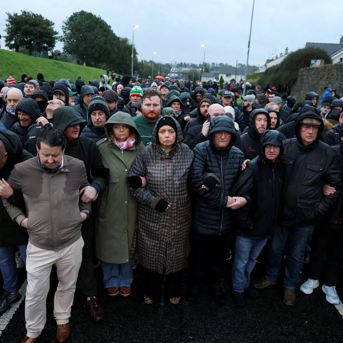 People block the Garvaghy road, a Catholic enclave in the largely Protestant town of Portadown, on the day members of the Protestant Orange Order are expected to march through the area as they take part in the annual Drumcree parade, Northern Ireland, September 27, 2026. REUTERS/Cathal McNaughton