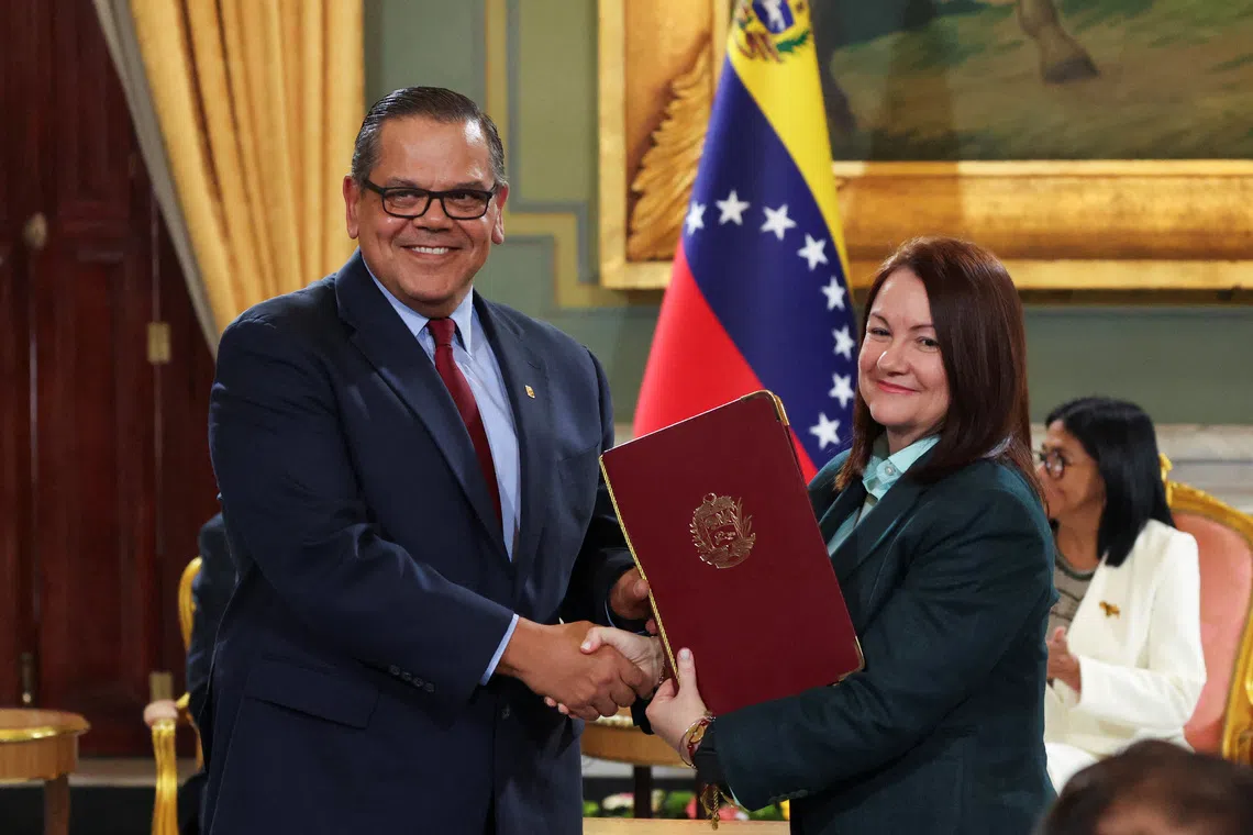 Chevron Venezuela President Mariano Vela shaking hands with Venezuela’s Oil Minister Paula Henao as they attend the signing of an agreement on Sept 2 in Caracas, Venezuela.