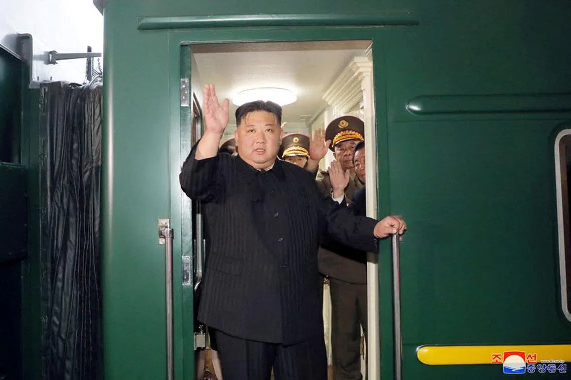 North Korean leader Kim Jong Un waves from a private train as he departs Pyongyang, North Korea, to visit Russia, September 10, 2023, in this image released by North Korea's Korean Central News Agency on September 12, 2023.   KCNA via REUTERS