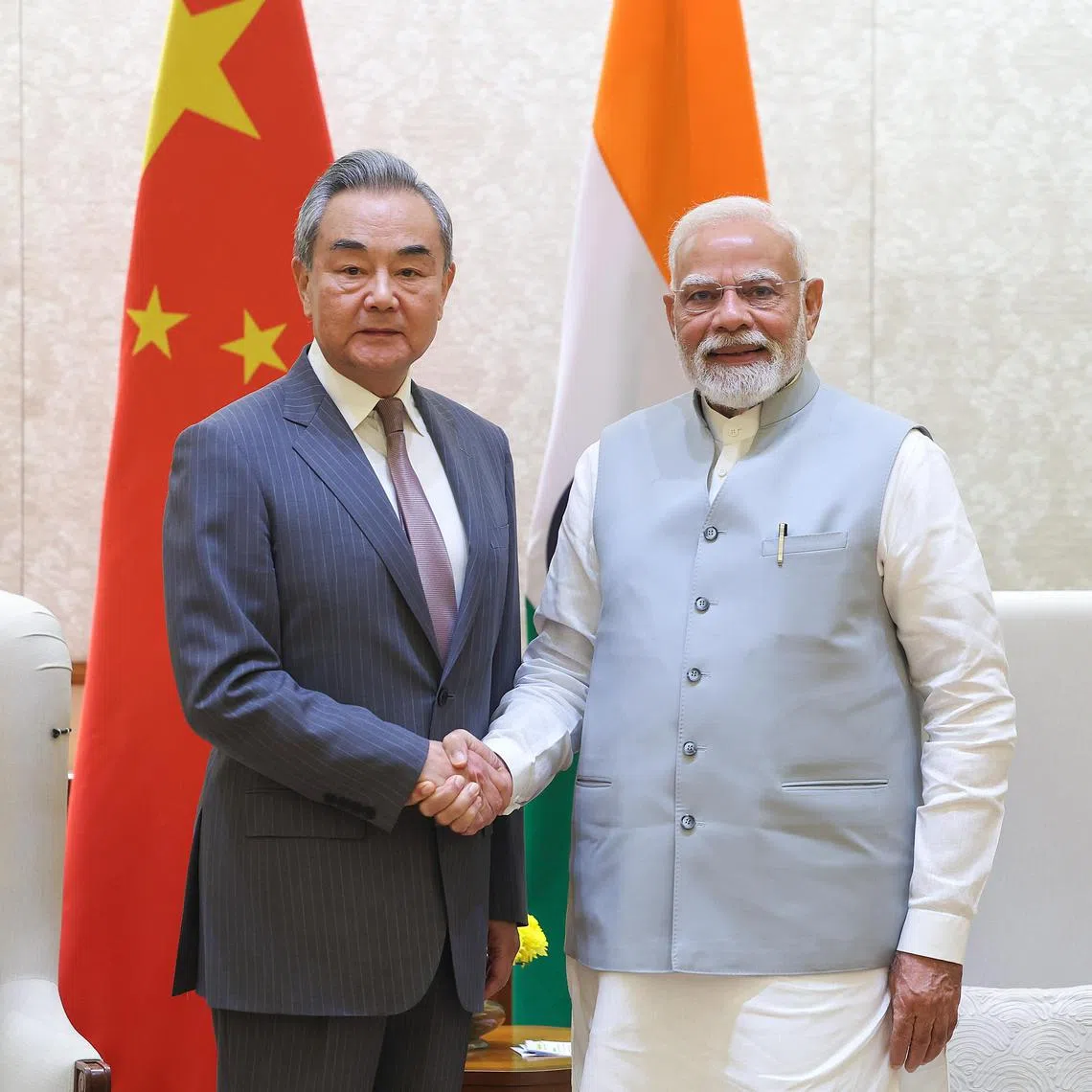Chinese Foreign Minister Wang Yi (left) being welcomed to New Delhi on Aug 19 by Indian Prime Minister Narendra Modi.
