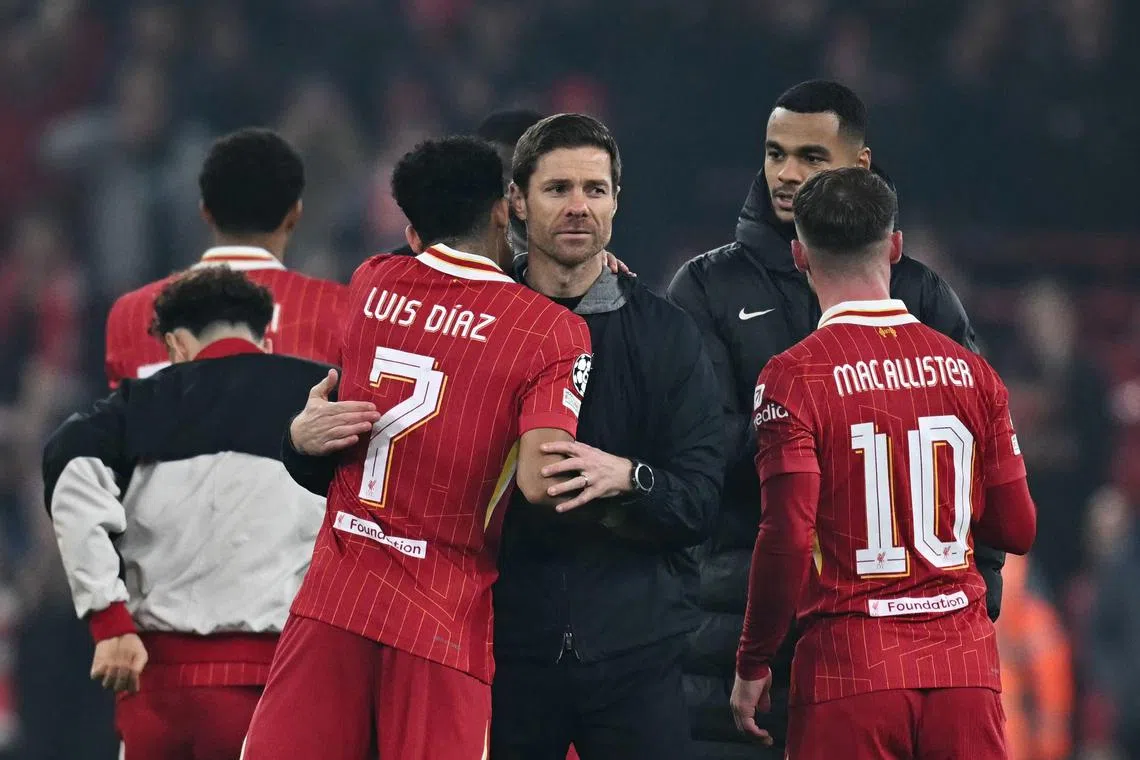 Bayer Leverkusen head coach Xabi Alonso congratulates Liverpool's Luis Diaz at the end of their Champions League clash, which the Reds won 4-0 thanks to Diaz's hat-trick.