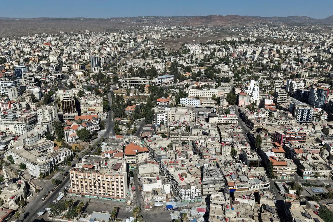 FILE PHOTO: A drone view shows the predominantly Druze city of Sweida, following deadly clashes between Druze fighters, Sunni Bedouin tribes and government forces, in Syria July 25, 2025. REUTERS/Khalil Ashawi/File Photo