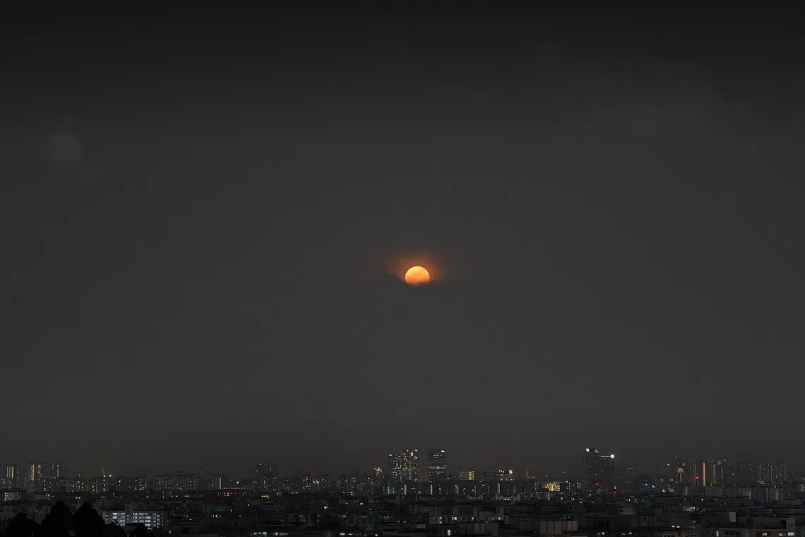 Timelapse image of the super blue moon rising captured from the NTU Student Services Centre on Aug 31, 2023, between 8pm and 8.45pm.