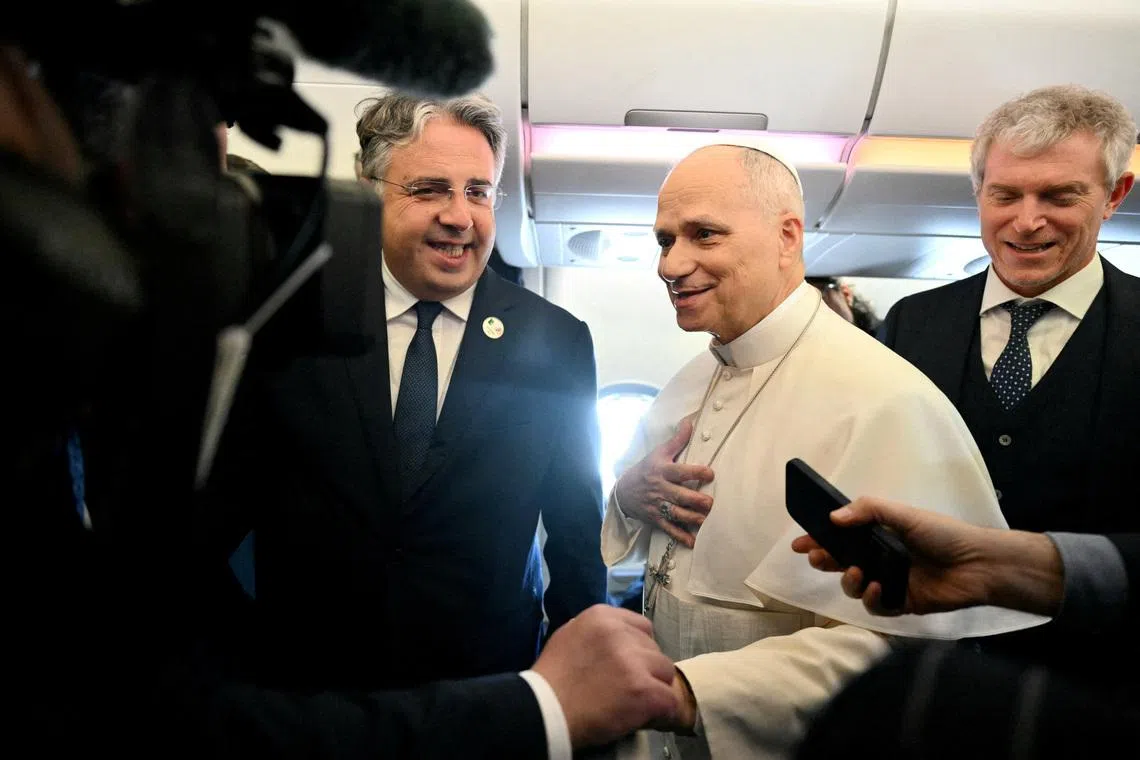 Pope Leo XIV addresses journalists during the flight heading to Algiers on April 13, 2026. Pope Leo XIV embarks today on an 11-day visit to Algeria, Cameroon, Angola and Equatorial Guinea for his first major international trip since becoming pontiff last year. ALBERTO PIZZOLI/Pool via REUTERS