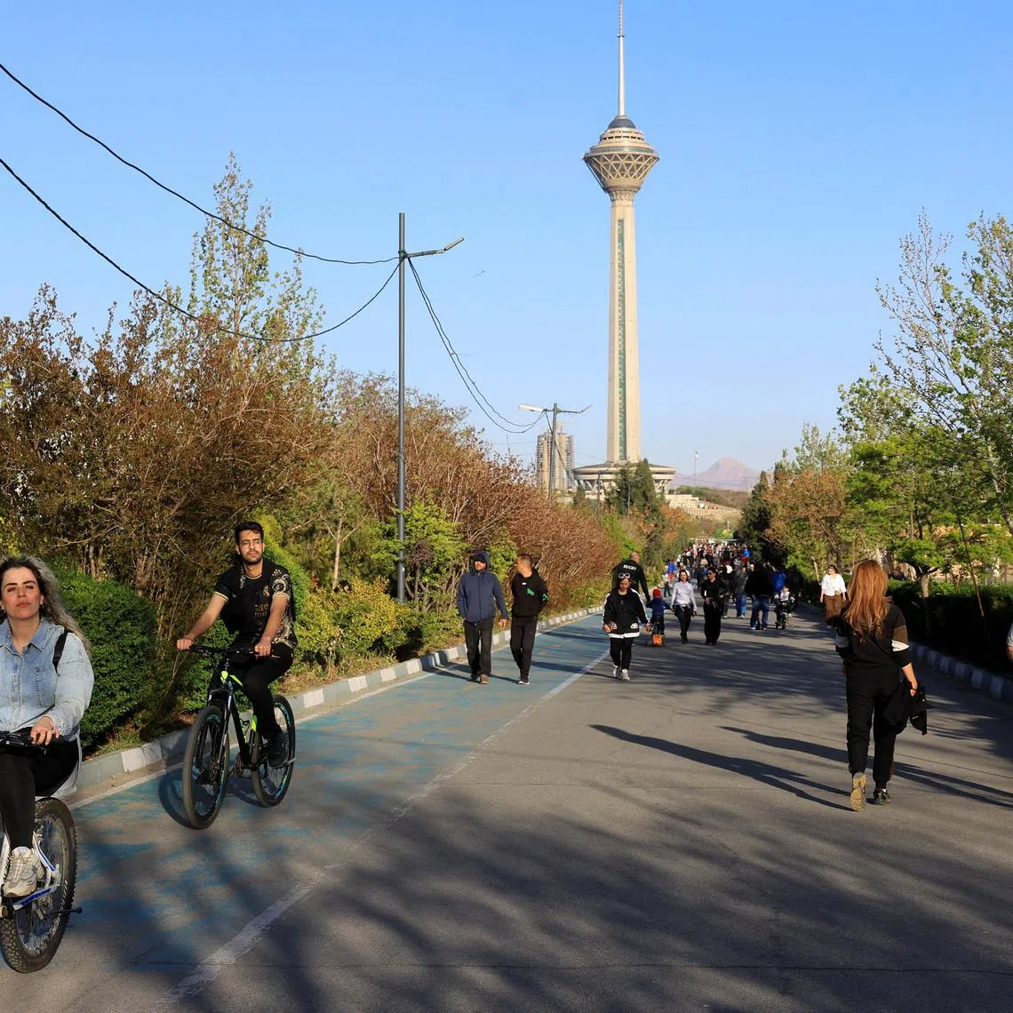 Iranians enjoy a sunny day in a public park, amid a two-week ceasefire in the US-Israeli conflict with Iran, in Tehran.