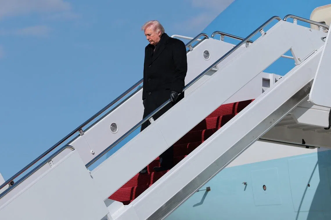 U.S. President Donald Trump disembarks Air Force One as he arrives at Joint Base Andrews, Maryland, U.S., March 18, 2026.