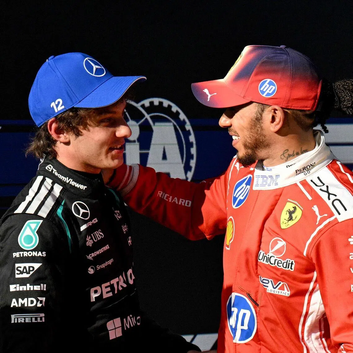 Ferrari driver Lewis Hamilton (right), who placed third in qualifying, congratulates Mercedes' Kimi Antonelli on achieving pole position for the Chinese Grand Prix.