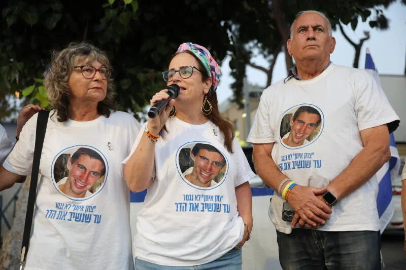 Supporters wearing t-shirts with the image of Israeli soldier Hadar Goldin at the National Centre of Forensic Medicine in Tel Aviv, Israel.