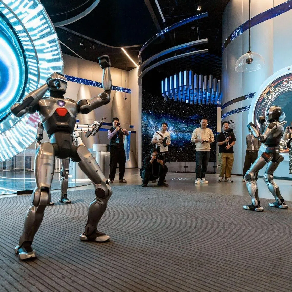 Humanoid robots perform at the Shenzhen Science and Technology Museum on Nov 26, 2025. 
