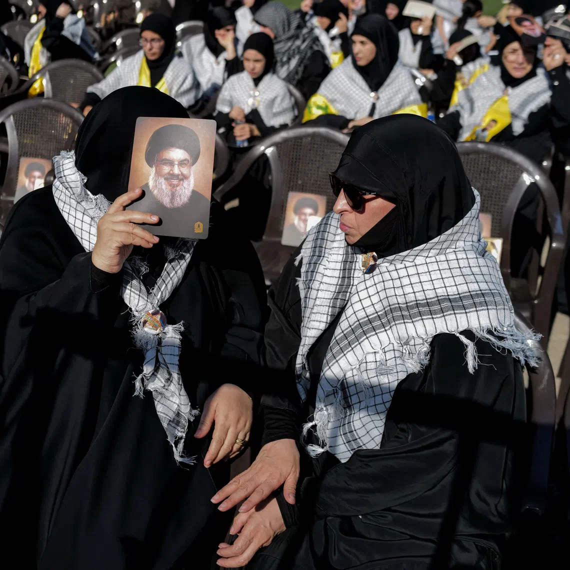 A Hezbollah supporter holds an image of late Hezbollah leader Hassan Nasrallah at a ceremony held by Hezbollah to commemorate the second anniversary of Hassan Nasrallah's killing by Israel, in Beirut's southern suburbs, Lebanon, September 27, 2026. REUTERS/Zohra Bensemra