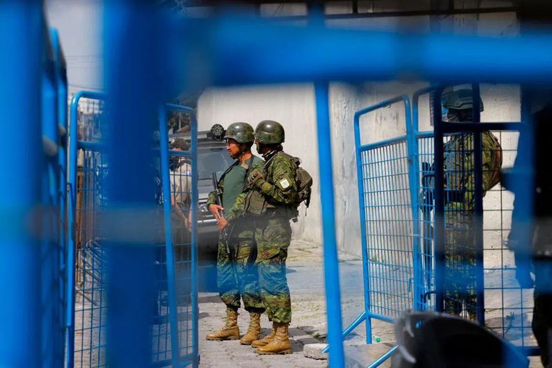 FILE PHOTO: Military personnel guard the entrance to El Inca prison after a security operation due to riots, following the disappearance of Jose Adolfo Macias, alias 'Fito', leader of the Los Choneros criminal group, in Quito, Ecuador January 8, 2024. REUTERS/Karen Toro/File Photo