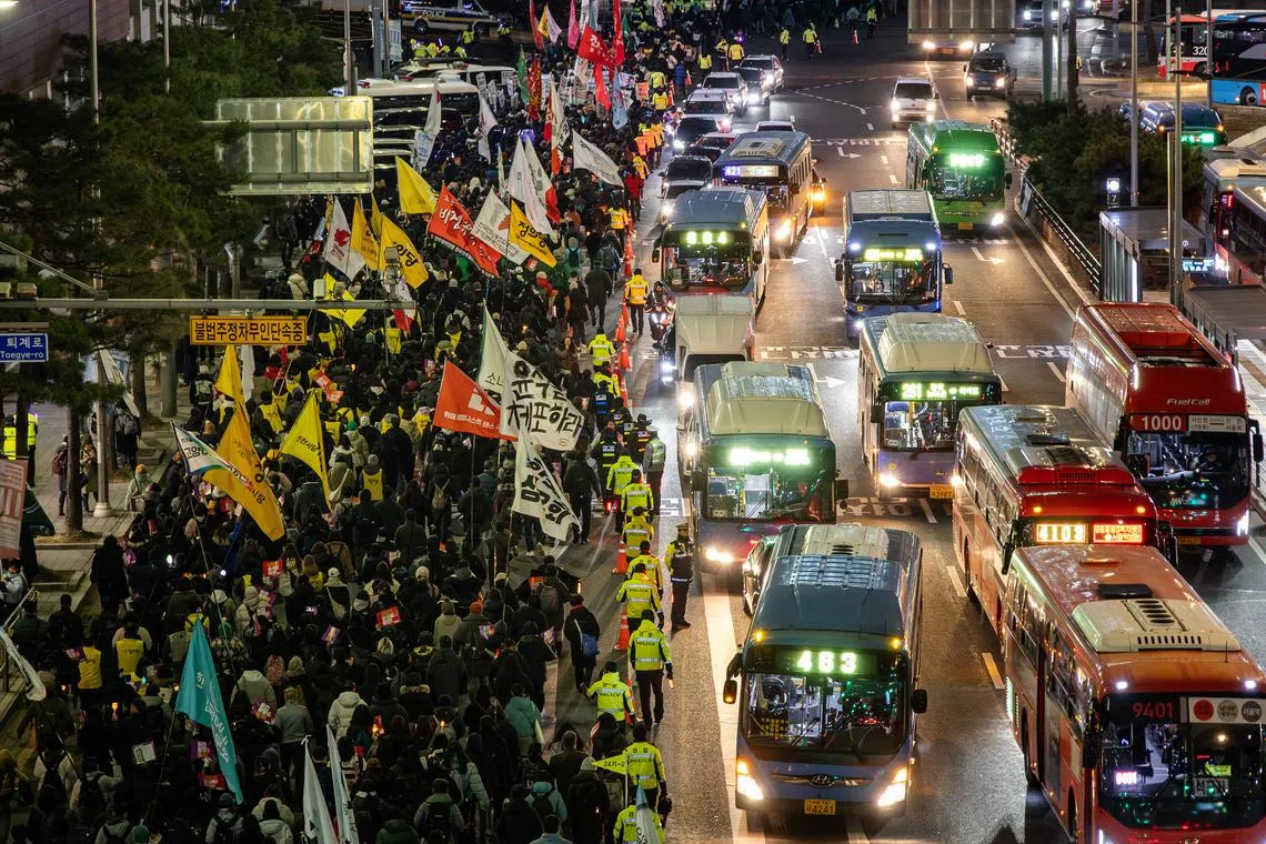Protesters march through central Seoul on Dec 4, demanding President Yoon Suk Yeol to resign.
