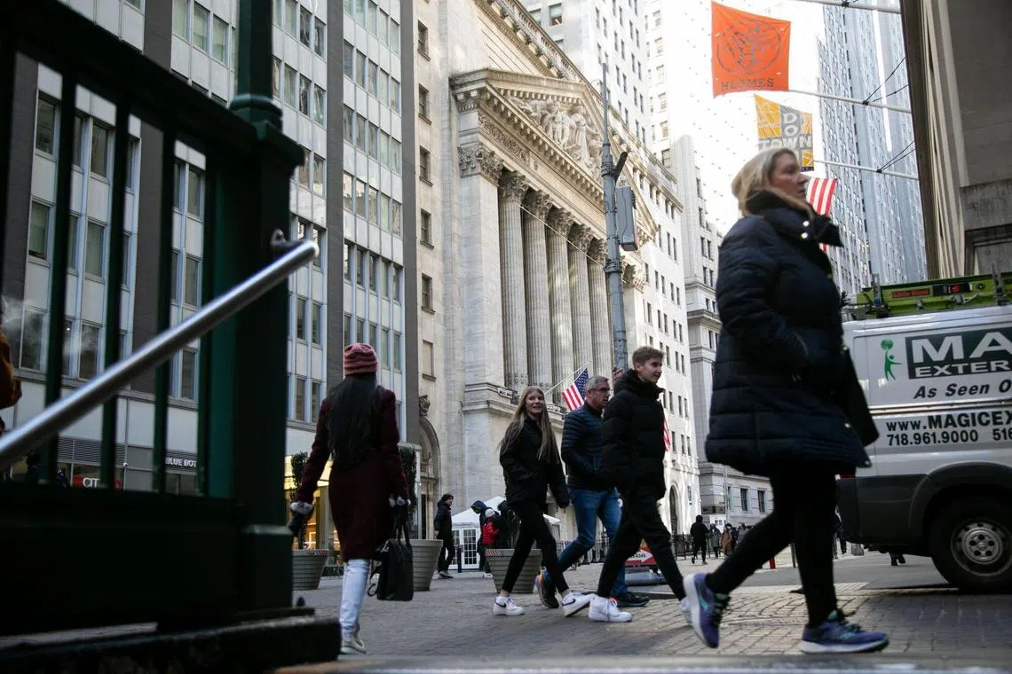 Pedestrians in front of the New York Stock Exchange (NYSE) in New York, US, on Friday, Feb. 16, 2024. Wall Street is ending the week on a bit of a sour note, with stocks and bonds falling after economic data continued to fuel speculation the Federal Reserve will be in no rush to cut interest rates. Photographer: Michael Nagle/Bloomberg