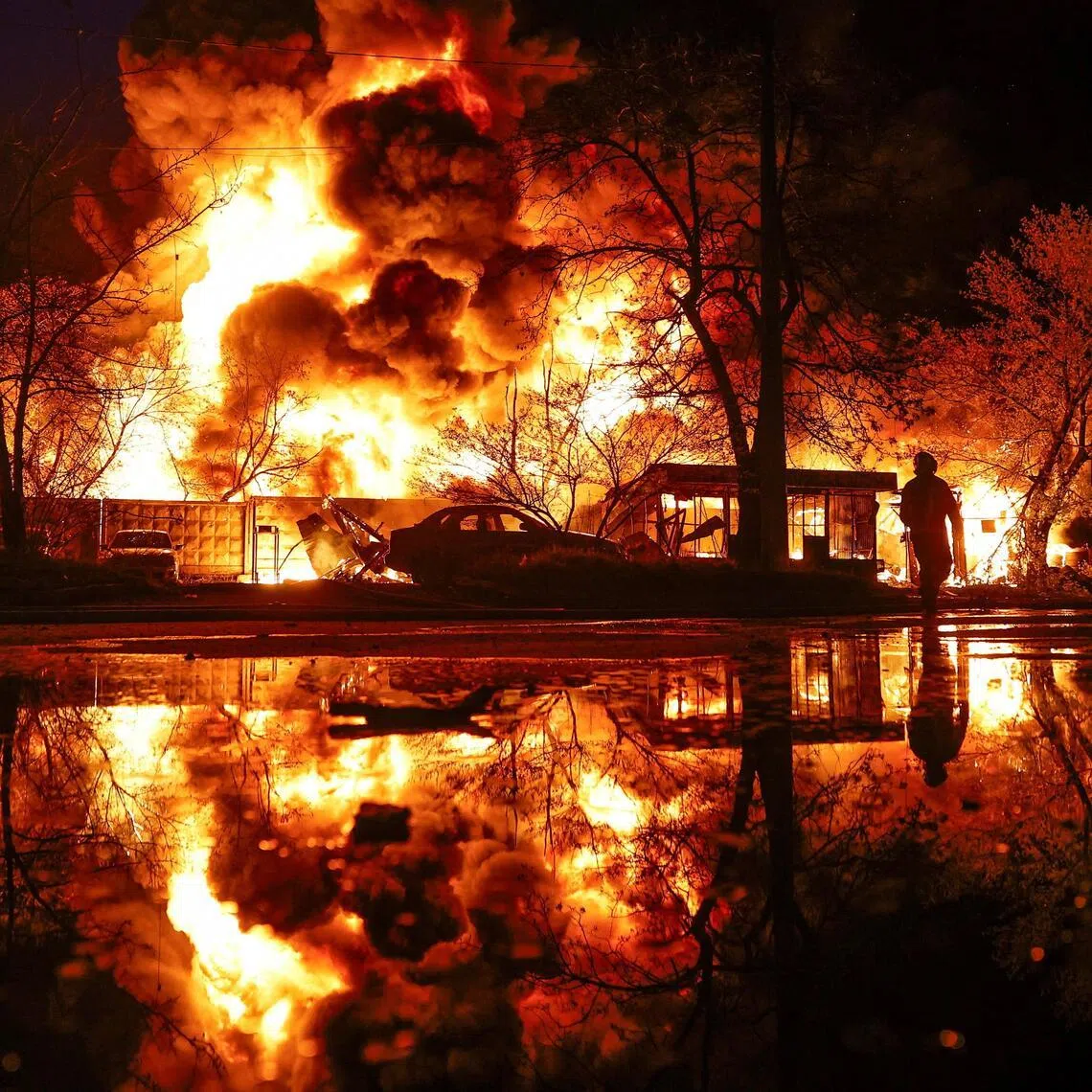 The aftermath of a recyclable materials warehouse hit by a Russian missile strike on April 16. Scores were wounded in drone and missile strikes by Russia on Ukrainian cities overnight.