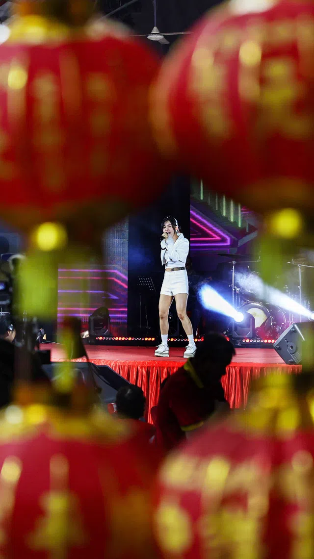 Getai singer Catherine Yee performing on stage at a hungry ghost festival getai show at Toa Payoh Industrial Park on Aug 20, 2026. ST PHOTO: BRIAN TEO