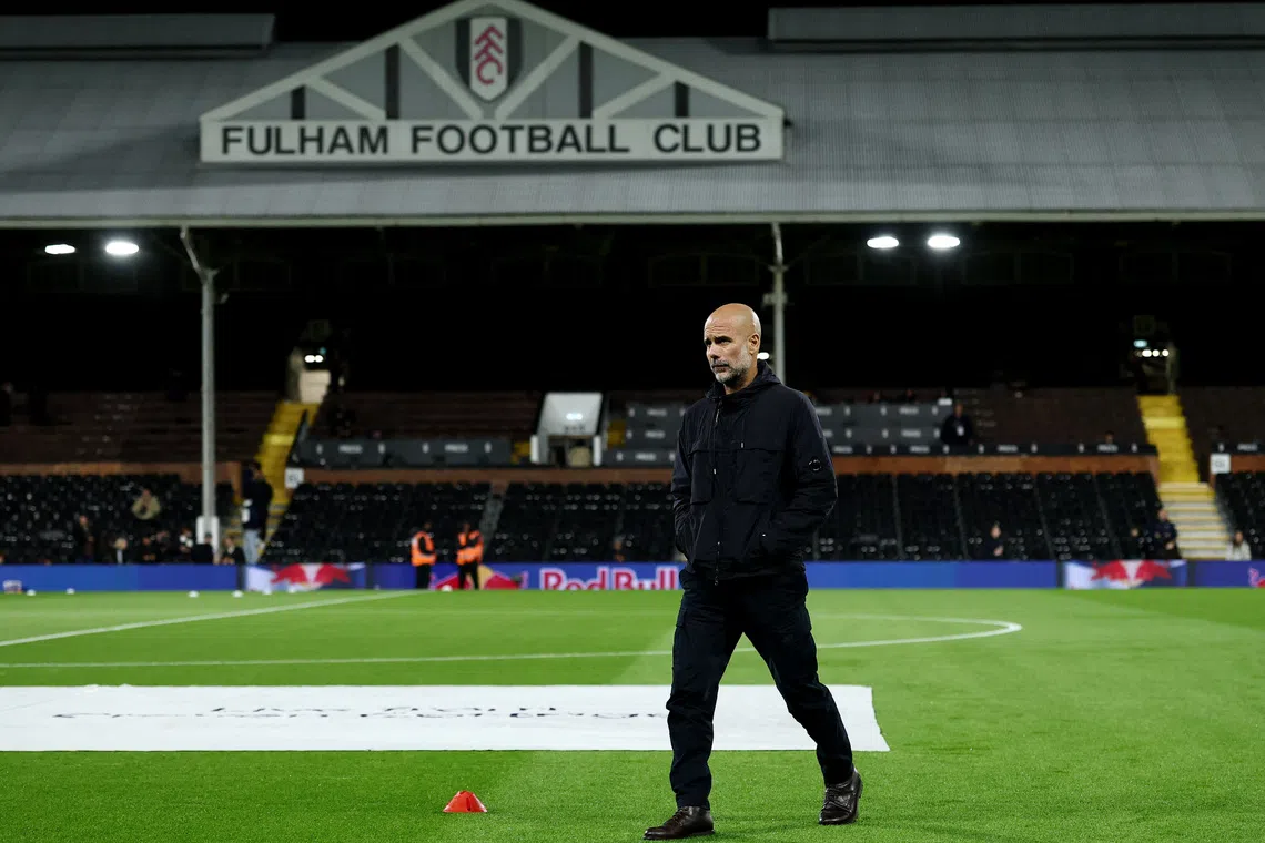 Soccer Football - Premier League - Fulham v Manchester City - Craven Cottage, London, Britain - December 2, 2025  Manchester City manager Pep Guardiola on the pitch before the match REUTERS/David Klein
