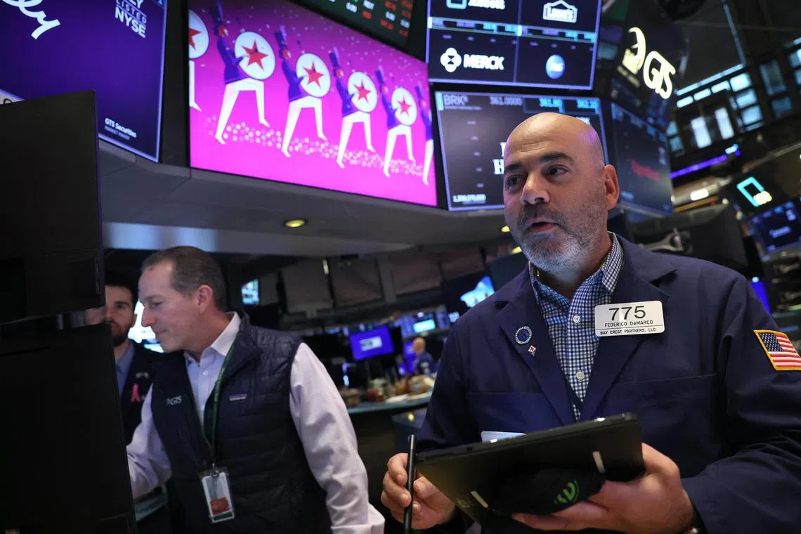 Traders work on the trading floor of the New York Stock Exchange, in New York City.