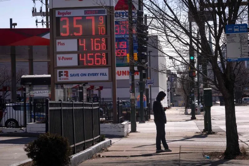 A sign displays prices for gasoline at a station on March 02, 2026 in Chicago, Illinois. 