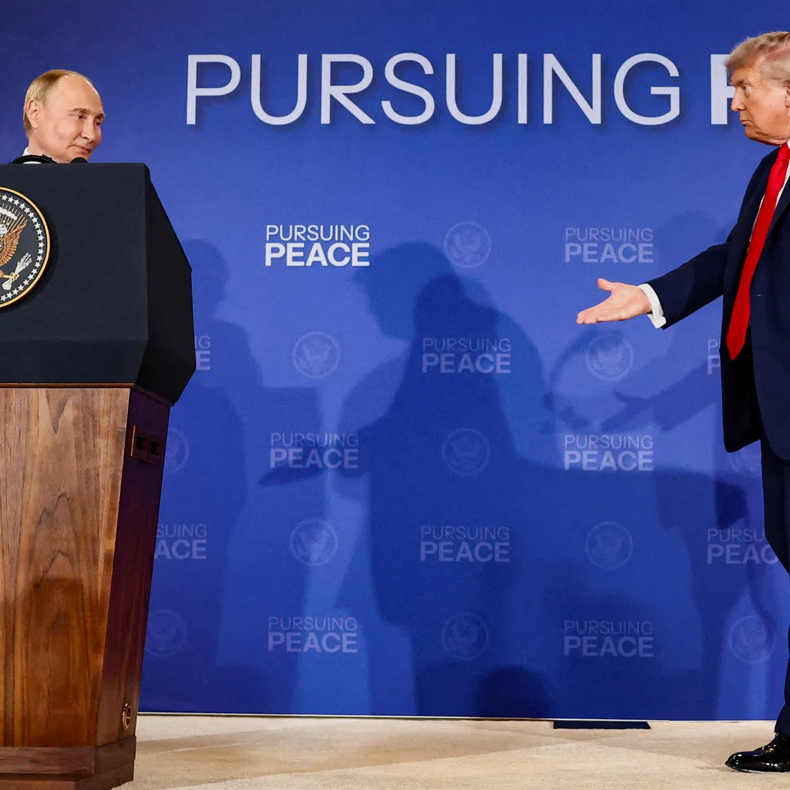 FILE PHOTO: U.S. President Donald Trump walks towards Russian President Vladimir Putin during a press conference following their meeting to negotiate an end to the war in Ukraine, at Joint Base Elmendorf-Richardson, in Anchorage, Alaska, U.S., August 15, 2025. REUTERS/Kevin Lamarque/ File Photo