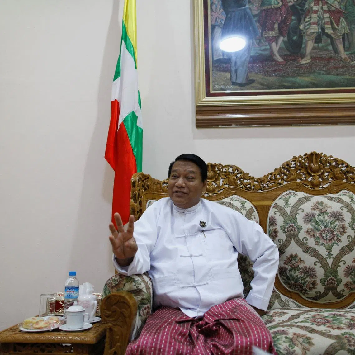 FILE PHOTO: Myanmar's Minister of Immigration and Population Khin Yi talks during an Reuters interview at his office in Naypyitaw June 10, 2013. REUTERS/Soe Zeya Tun/File Photo