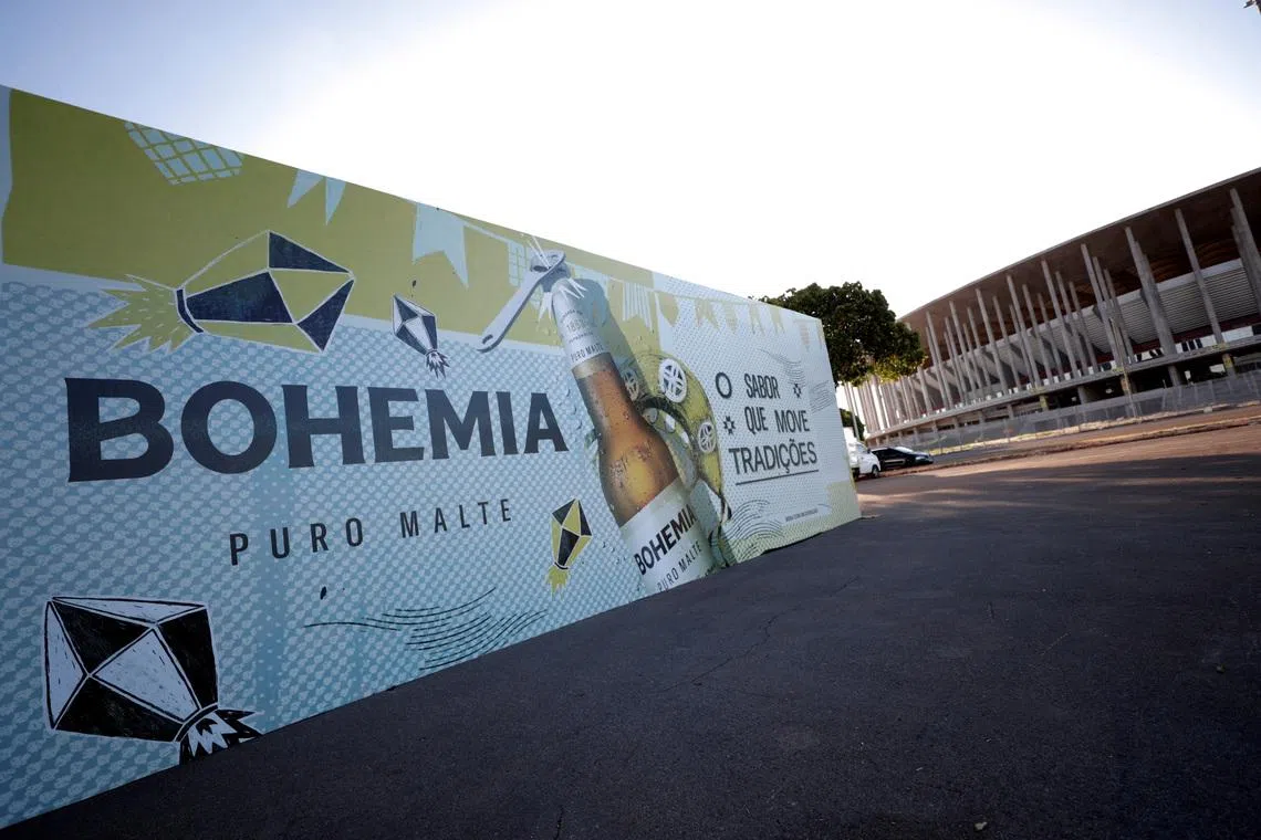 FILE PHOTO: A booth of Bohemia beer produced by Brazil-based Ambev, is mounted in front of the stadium of the Mane Garrincha National Stadium in Brasilia, Brazil June 9, 2021. REUTERS/Ueslei Marcelino/File Photo