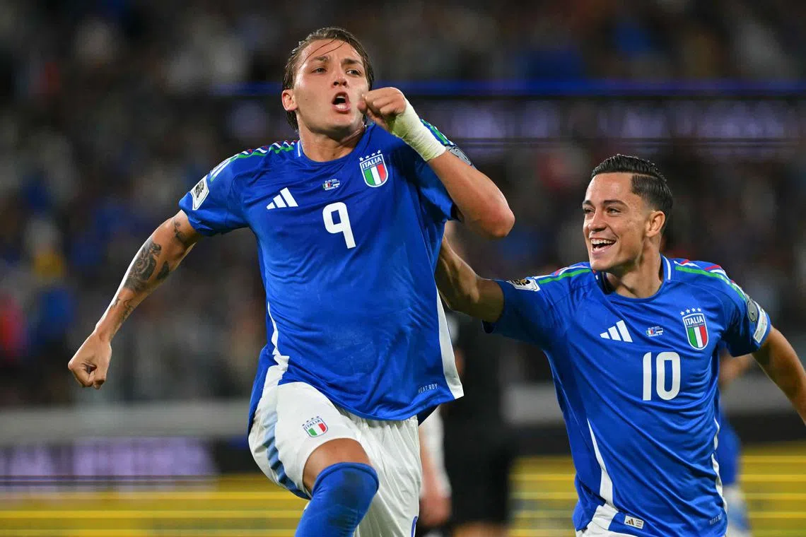 Italy forward Mateo Retegui (left) celebrates with teammates after scoring his team's second goal, his first of the night.
