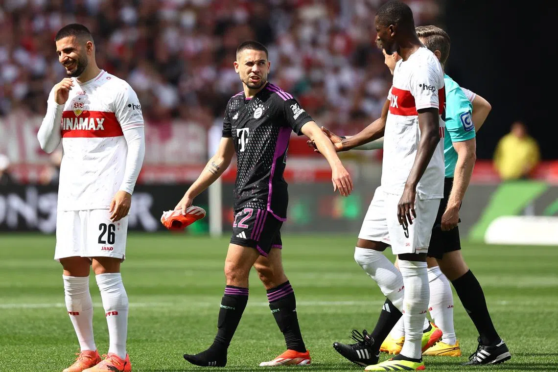 Soccer Football - Bundesliga - VfB Stuttgart v Bayern Munich - MHPArena, Stuttgart, Germany - May 4, 2024 Bayern Munich's Raphael Guerreiro walks off the pitch after being substituted due to injury REUTERS/Kai Pfaffenbach