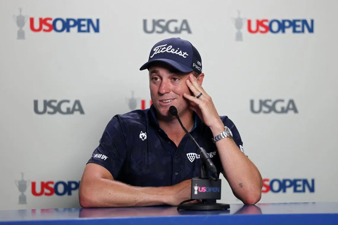 Justin Thomas of the United States speaks to the media during a practice round prior to the 125th US Open.