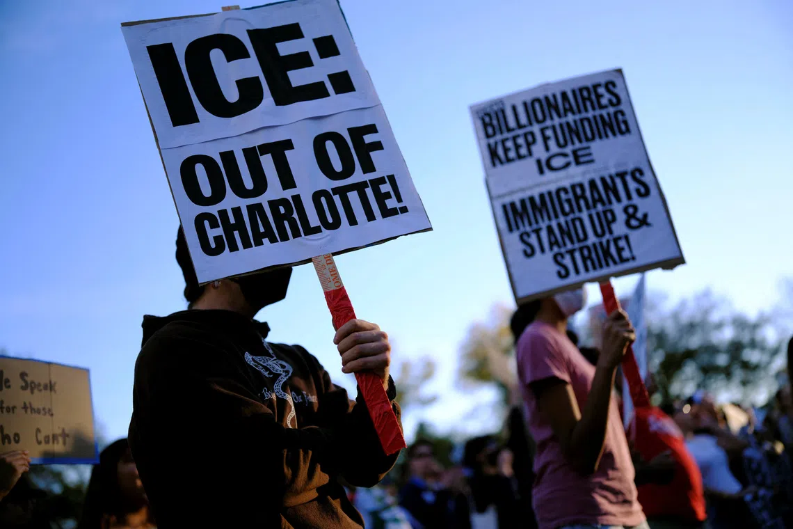 People protest as federal authorities conduct raids in Charlotte, expanding their crackdown on illegal immigration, in Raleigh, North Carolina, U.S. November 16, 2025.  REUTERS/Jonathan Drake