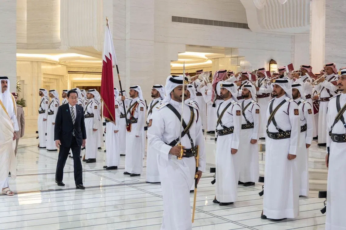 Qatar's Emir Sheikh Tamim bin Hamad Al-Thani with Japan's Premier Fumio Kishida at a ceremony in Doha on Tuesday.