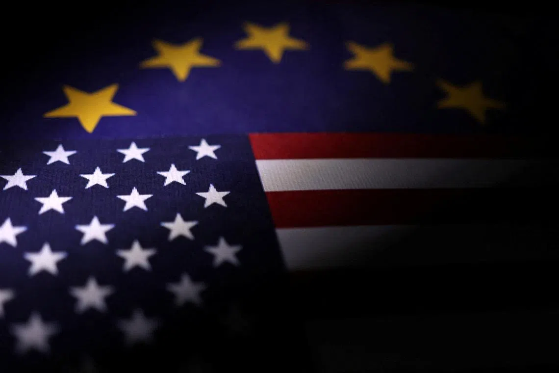 U.S. and European Union flags are seen in this illustration taken April 10, 2025. REUTERS/Dado Ruvic/Illustration