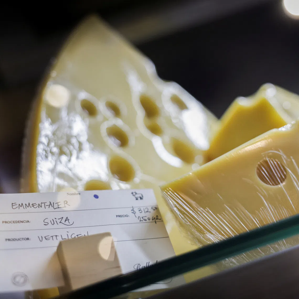 An Emmentaler cheese imported from Switzerland is displayed in a store as a dispute over protected cheese names has emerged as a flashpoint in trade talks involving Mexico, the United States and the European Union, in Mexico City, Mexico August 26, 2026. REUTERS/Raquel Cunha