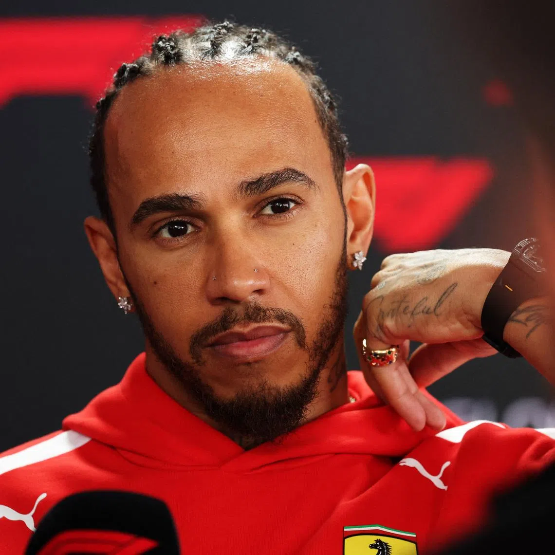 Formula One F1 - Japanese Grand Prix - Suzuka Circuit, Suzuka, Japan - March 26, 2026 Ferrari's Lewis Hamilton speaks to the media ahead of the Japanese Grand Prix REUTERS/Issei Kato
